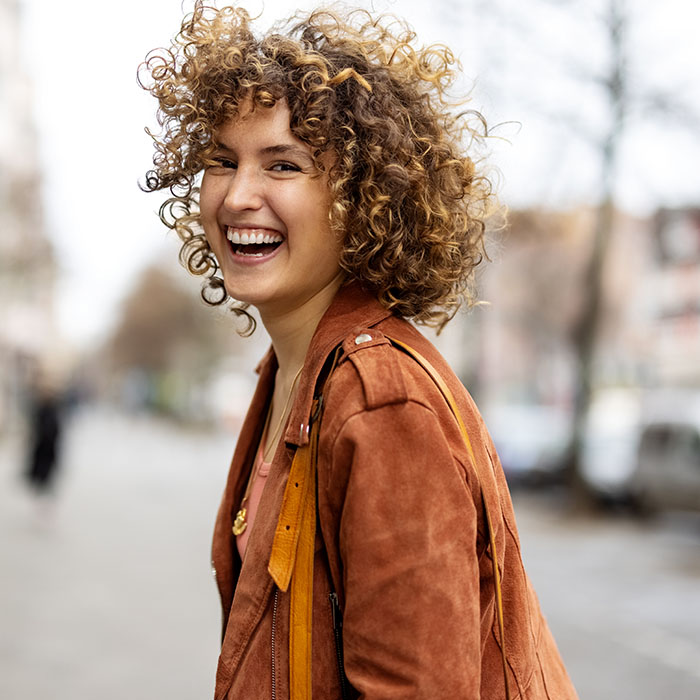 woman happily smiling